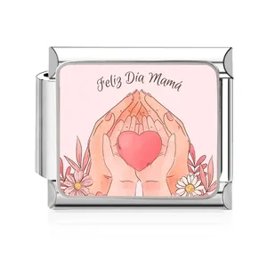Detailed macro shot of stainless steel Italian charm with 'Feliz Día Mamá' heart design