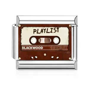 Close-up of stainless steel modular bracelet charm featuring retro cassette tape design.