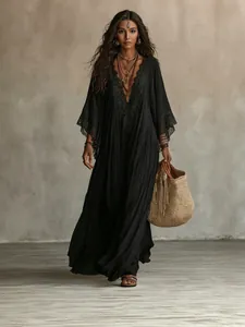 Bohemian black lace V-neck maxi dress with batwing sleeves and flowy resort style