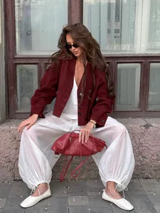 Detail of fashionable semi-transparent loose trousers with drawstring cuffs