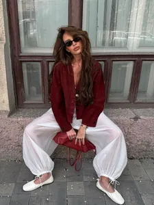 White loose sheer pants with drawstring cuffs for fashionable spring summer wear