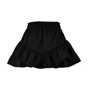 Close-up of a high-waisted black mini skirt featuring an elegant ruffled tiered design