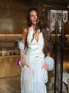 Detailed look at elegant white semi-sheer drawstring wide-leg trousers for women