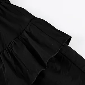 Detailed view of layered ruffles on a black high-waisted tiered cake skirt