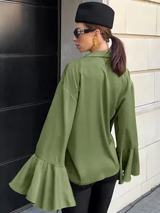 Detailed back view of a green satin blouse featuring elegant long ruffle flared sleeves