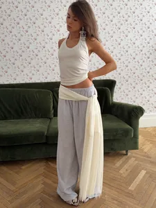 Elegant cream satin wrap belt detail featuring long luxurious fringe tassels for women