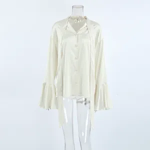 Elegant cream satin blouse featuring a stylish bow-tie neck and ruffled bell sleeves.