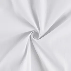 Macro close-up of high-quality white pure cotton fabric showing soft texture and spiral drape