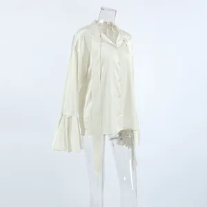 Elegant cream satin blouse featuring a sophisticated tie-neck and ruffled flare sleeves