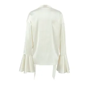 Back view of an elegant cream satin blouse featuring ruffled bell sleeves and tie neck