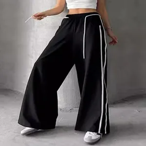 Pantalon de jogging noir pour femme à jambes larges avec bandes latérales et cordon