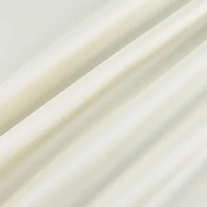 High-quality close-up showing the fine texture of off-white elegant camisole fabric