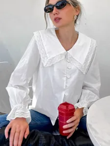 Elegant white French style cotton blouse with lace collar and bell cuffs