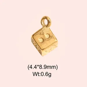 Detail view of a gold-plated stainless steel mini dice pendant for jewelry DIY