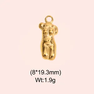 Detailed view of vintage gold stainless steel female body torso pendant for DIY jewelry making.