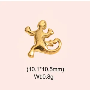 Detailed macro view of golden lizard pendant showing 10.1x10.5mm size and 0.8g weight