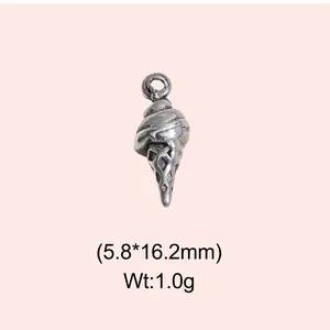 Detailed view of a vintage stainless steel ice cream cone charm for DIY jewelry making
