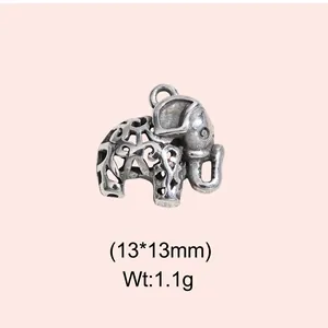Detailed view of a vintage hollow-out metal elephant charm with size and weight info