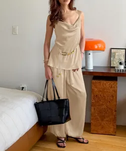 Elegant champagne satin camisole and wide-leg trousers two-piece set for a summer look