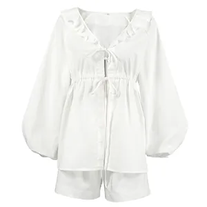 Elegant white cotton linen two-piece set featuring ruffle V-neck and balloon sleeves