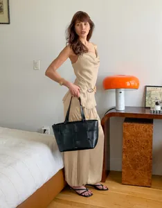 Elegant champagne satin camisole and wide-leg trousers lounge set shown on a fashion model