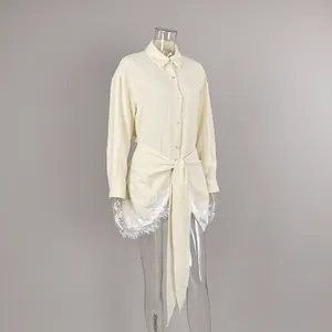 French style tie-waist wrap blouse with delicate lace hem shown on a clear mannequin