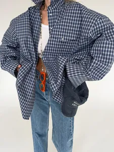 Vintage blue plaid cotton shirt for women featuring an oversized fit and silver snap buttons