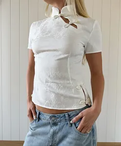 Elegant white jacquard top featuring a Mandarin collar and traditional frog buttons