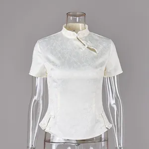 Detail of white New Chinese style blouse featuring elegant jacquard floral patterns