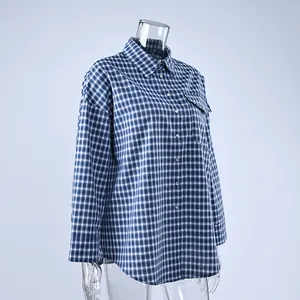 Detailed side profile of a vintage blue and white plaid cotton shirt for women