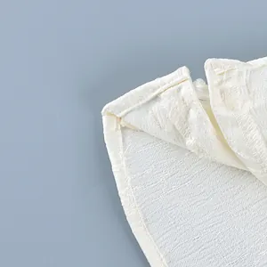 Close-up view of the textured fabric and stitching on a new Chinese style retro shirt