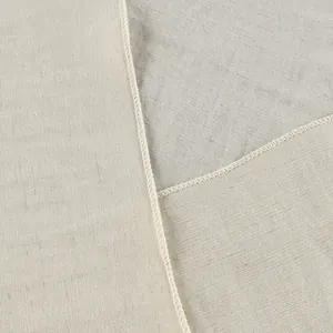 Macro detail of the fabric texture and durable overlock stitching on a linen shirt.