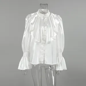 Detailed view of white satin court style blouse with ruffled front and flared sleeves