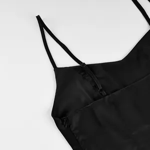 Detail view of a black slim fit camisole top featuring thin straps and side zipper closure