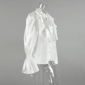 Elegant white satin ruffle blouse detail featuring flared sleeves and stand collar side view