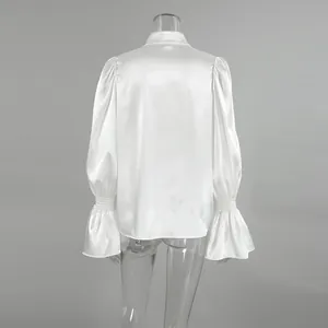 Back view of elegant French style white satin blouse with ruffled flared bell sleeves