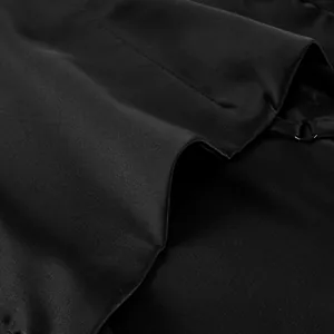 Detailed close-up of the smooth black fabric and thin strap of a women's camisole