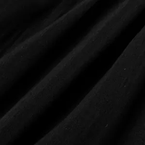Macro view of high quality black woven fabric texture with natural elegant folds detail