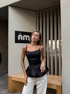 Elegant black peplum camisole top with slim fit design for summer style