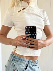 Modern Chinese-style white short-sleeve top featuring classic mandarin collar and buttons