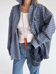 Oversized vintage blue and white plaid cotton shirt for women in a casual street style look