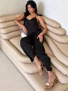 Minimalist black satin camisole top and straight-leg trousers chic two-piece set