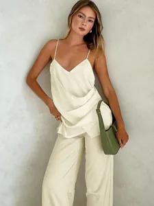 Elegant off-white satin camisole and wide-leg trouser set for a chic summer look
