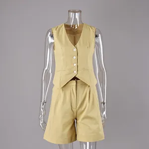 Yellow cotton linen two-piece suit set displayed on a transparent mannequin, detail view