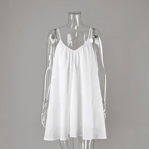 Detail view of a white V-neck camisole dress with loose A-line silhouette for summer.