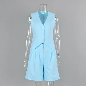 Detailed front view of a light blue cotton linen vest and shorts suit on a mannequin