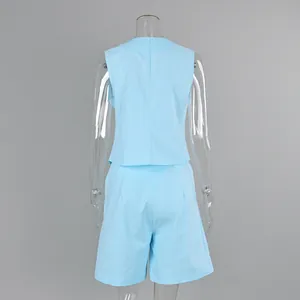 Back view detail of a light blue linen sleeveless vest and shorts two-piece set
