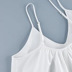 Detail of white V-neck dress with adjustable spaghetti straps and linen fabric