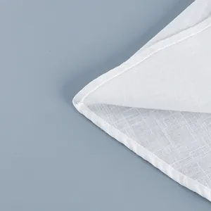 Detailed close-up showing the texture of white breathable fabric and quality hem stitching