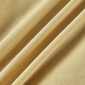 Close-up macro view of beige linen cotton fabric texture with natural weave details.